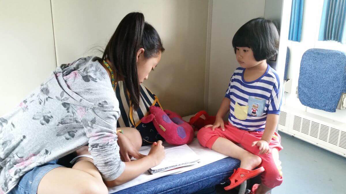 Welcome Aboard author and little girl drawing