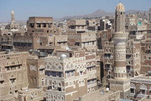This city in Yemen, Saana, is similar in architecture to the painting, below, of a town in Saudi Arabia.