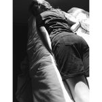 A photograph looking up at a line of people.