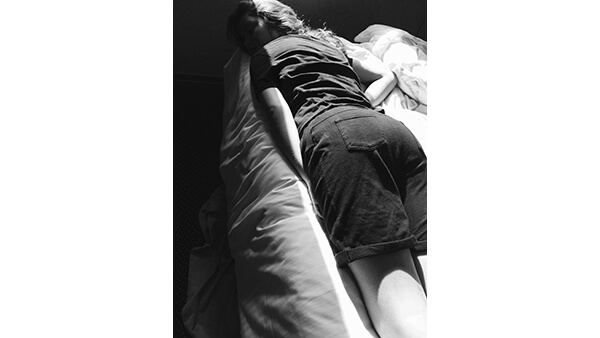 A photograph looking up at a line of people.