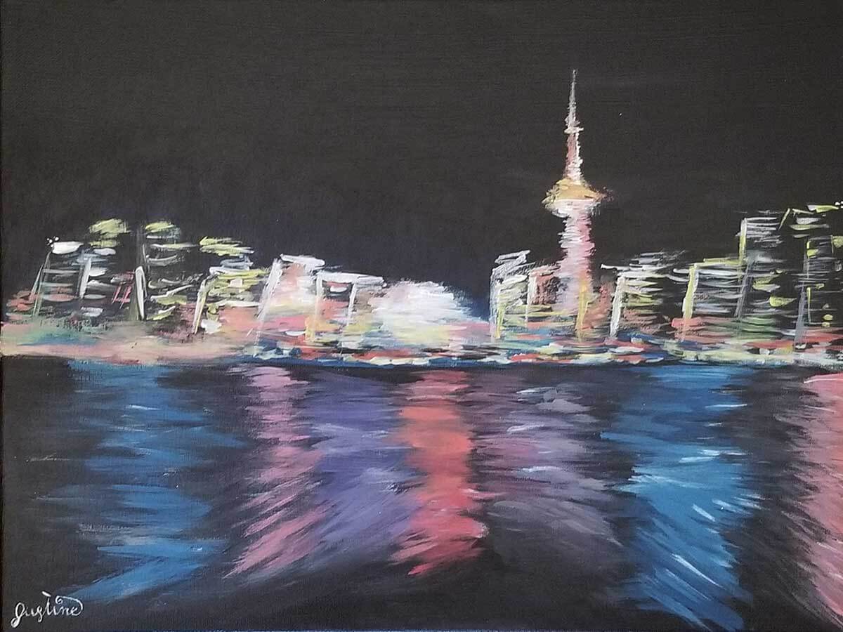 An acrylic painting of the city of Toronto, lit up at night and reflected in the water.