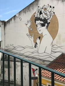 A photograph of a mural in a city street.