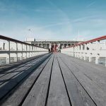 A photograph of a bridge. Lines lead to the centre of the image.