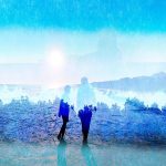 Photograph of two figures against a blue backdrop of a forest